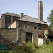 View of boiler house, left and Shaving Area.