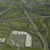 Oblique aerial view centred on the motorway interchange, taken from the WSW.