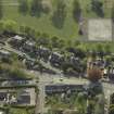 Oblique aerial view centred on the houses, taken from the ENE.