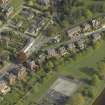 Oblique aerial view centred on the houses, taken from the NW.