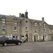 View of courtyard area flooking to main block and clock tower rom SE