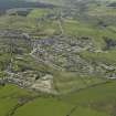 General oblique aerial view looking towards the village of Dalmellington, taken from the NW.