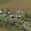 General oblique aerial view centred on the house with caravan park adjacent, taken from the NE.