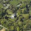 Oblique aerial view centred on the house with the walled garden adjacent, taken from the SE.