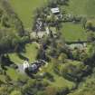 Oblique aerial view centred on the house with the walled garden adjacent, taken from the ESE.