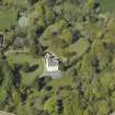 Oblique aerial view centred on the house with the walled garden adjacent, taken from the S.