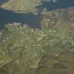 General oblique aerial view looking towards Ornsay and Ard Ghunel centred on the village with the adjacent harbour, taken from the SW.