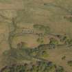 Oblique aerial view centred on the remains of the township and field banks, taken from the SE.