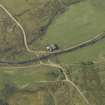 Oblique aerial view centred on the remains of the township, taken from the NE.