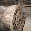 Aberdeenshire, Fasque House. Detail of semi-terranean timber water wheel in outbuilding to rear of courtyard.