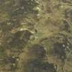 Oblique aerial view centred on the remains of the building, taken from the NW.
