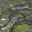 General oblique aerial view centred on the canal adjacent to the Seedhill and Auchtorlie estates and Anchor Thread Works, taken from the W.