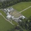 Oblique aerial view centred on the house, taken from the SW.