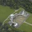 Oblique aerial view centred on the house, taken from the SE.