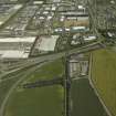 General oblique aerial view centred on the industrial estate and housing estate, taken from the SW.