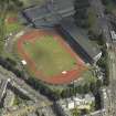 Oblique aerial view centred on the stadium, taken from the W.