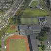 Oblique aerial view centred on the stadium with the velodrome adajacent, taken from the W.