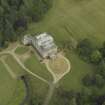Oblique aerial view centred on the country house with the burial vault adjacent, taken from the NW.