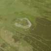 Oblique aerial view centred on the remains of the fort, taken from the SW.