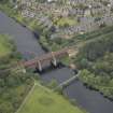 Oblique aerial view centred on the New Clyde railway viaduct, Uddingston, taken from the SSW.