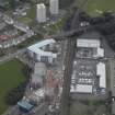 Oblique aerial view centred on Drybrough Crescent showing second phase of new housing development under construction, taken from the NNE.