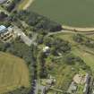 Oblique aerial view centred on the house with the paper mill filter beds adjacent, taken from the NE.