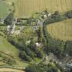 Oblique aerial view centred on the house with the paper mill filter beds adjacent, taken from the SW.