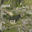 Oblique aerial view of Newtyle village centred on the Church, taken from the SSE.