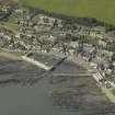 Oblique aerial view centred on the harbour with the town adjacent, taken from the E.