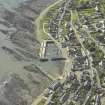 Oblique aerial view centred on the harbour and town, taken from the NE.