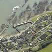 Oblique aerial view centred on the harbour and town, taken from the NW.