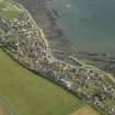 General oblique aerial view centred on the harbour and town, taken from the W.