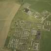 Oblique aerial view centred on the accommodation camp, taken from the SW.