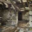 Interior. First floor. Looking towards first floor of storage area. The floor had been removed due to rotting.