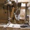 Interior. Ground floor. Sieve, note the shutes from the shelling (left) and the grinding stones (right).