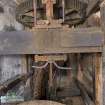 Interior. Ground floor. Gear Cupboard. View of bevel pit wheel, wallower, great spur wheel, upright shaft and stone nut for shelling stones top of image.