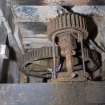 Interior. Ground floor. Milling area. Gear cupboard showing great spur wheel and stone nut of shelling stones above.