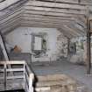 Interior. First floor. Milling area. View of mill floor, stones behind and to right of camera. Grain cist and conveyor frame visible.