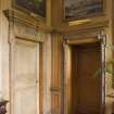 Interior.  General view of carved wooden door frames, entramce to Blue Room and Dining Room.