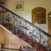 Interior.  General view of late 17th century wrought-iron staircase balustrade in hallway.