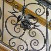 Interior.  Detail of staircase balustrade, rose motif.