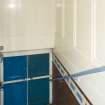 Interior. View of team exit via double front doors from 1st floor level changing rooms.  Also visible is recently painted brickwork.