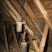 Interior. View of clock counterweights and pulley system in roof space.