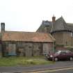 View of pantiled roofed store  building to S and part of rear elevation of pavilion from E