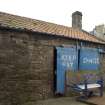 View of pantiled roofed store building to S from W