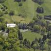 Oblique aerial view of Belleisle House with the walled garden and greenhouse adjacent, taken from the NW.