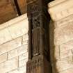 Interior. S aisle, detail of carved wooden pillar supporting roof