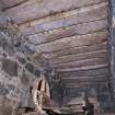 Interior. Waterwheel pit. View of stone roof above waterwheel. This supports the trackway above.