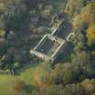 Oblique aerial view centred on the stable block, taken from the NE.