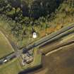 Oblique aerial view centred on the remains of the windmill, taken from the SW.